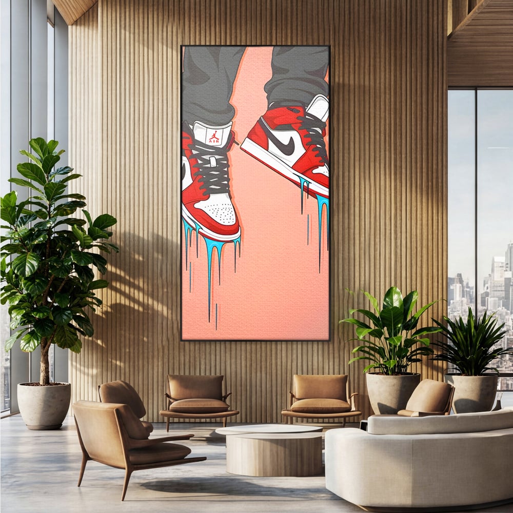 Tablou canvas cu ilustratie digitala cu adidasi rosii, in rama de aluminiu negru, pe perete intr-un birou